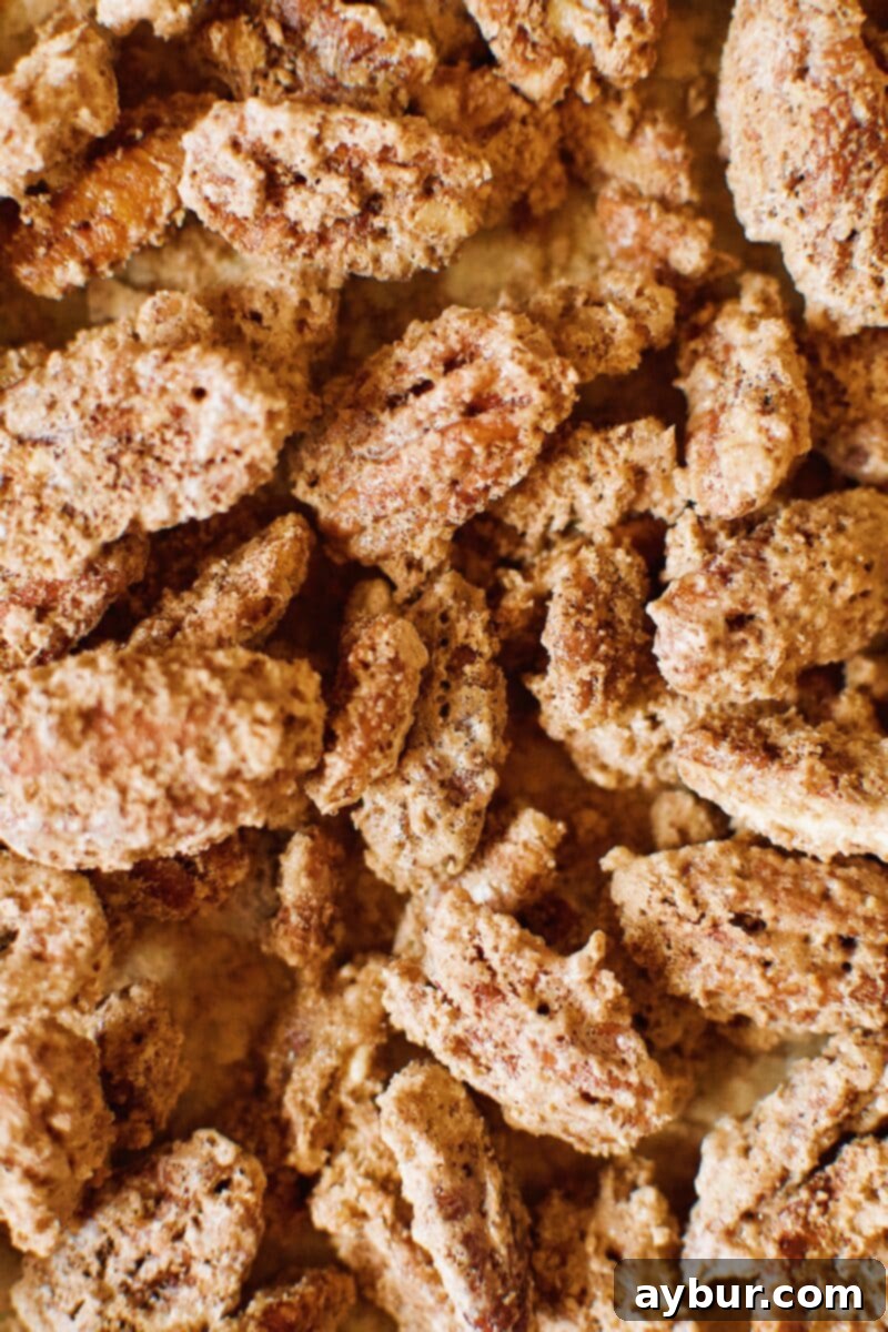 Harvest Pumpkin Spice Pecan Pralines 2 Freshly baked Pumpkin Spice Praline Pecans arranged on a rustic wooden board, ready to be enjoyed.