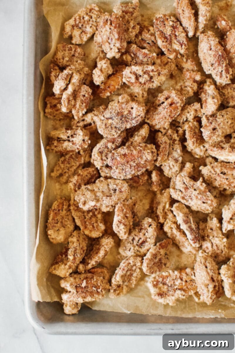 Harvest Pumpkin Spice Pecan Pralines 8 A freshly baked batch of Pumpkin Spice Praline Pecans, golden brown and glistening, on a cooling rack.
