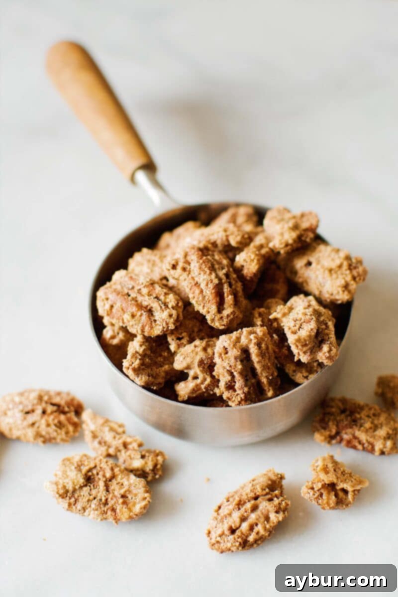 Harvest Pumpkin Spice Pecan Pralines 9 A close-up of a pile of freshly made Pumpkin Spice Praline Pecans, showing the sugary crust.