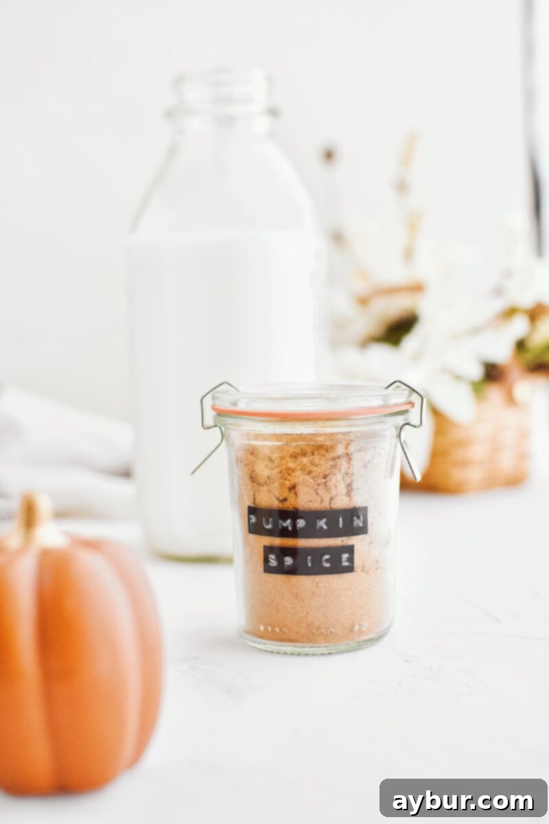 Freshly blended Homemade Pumpkin Pie Spice in a glass jar, ready for use.