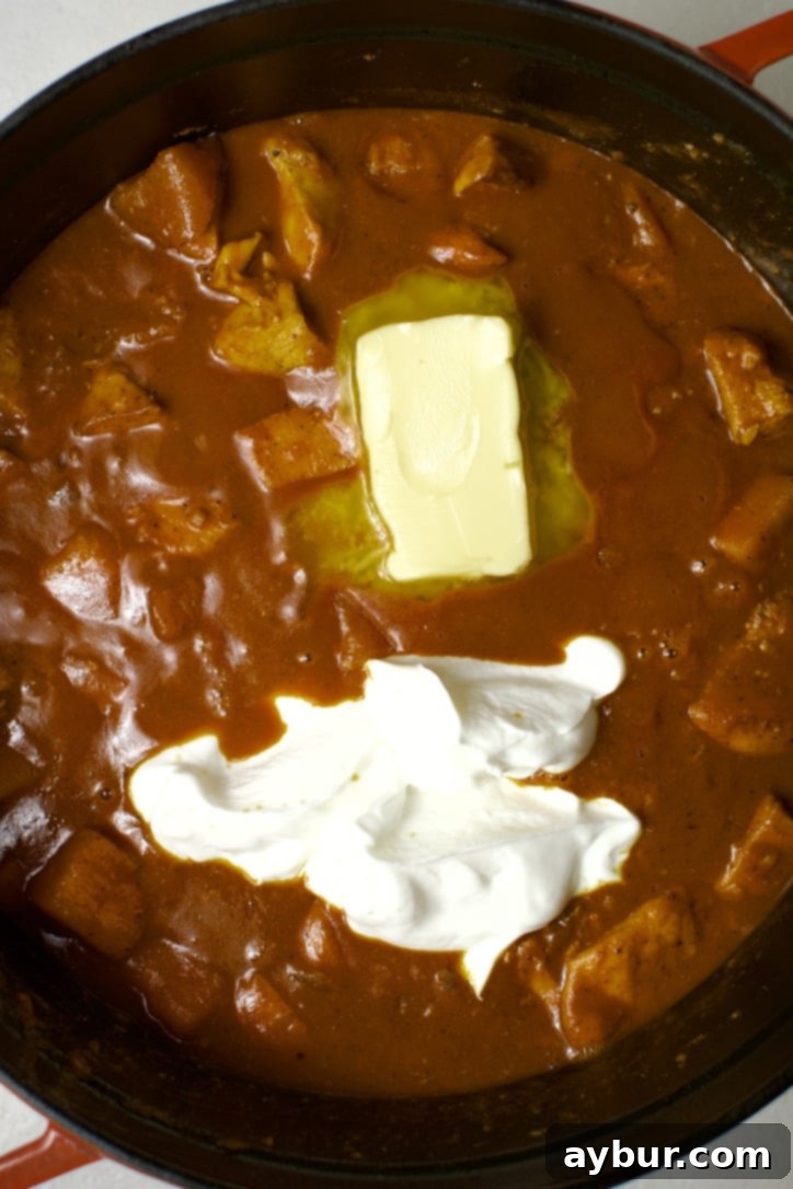 Finishing the Pumpkin Butter Chicken with greek yogurt and butter.