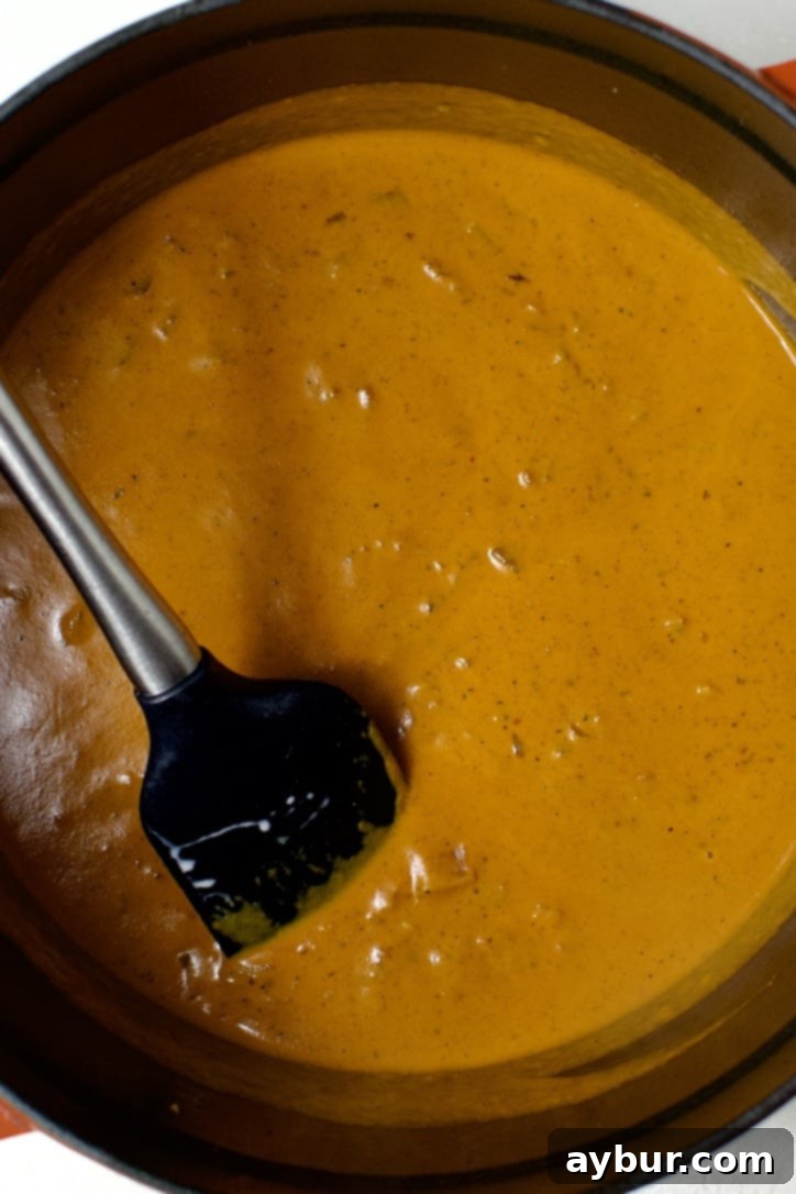 butter chicken sauce simmering in the pot.