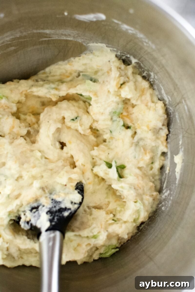 Loaded Baked Potato Mash 7 Finished Loaded Baked Potato Mashers in the mixing bowl, ready for serving.