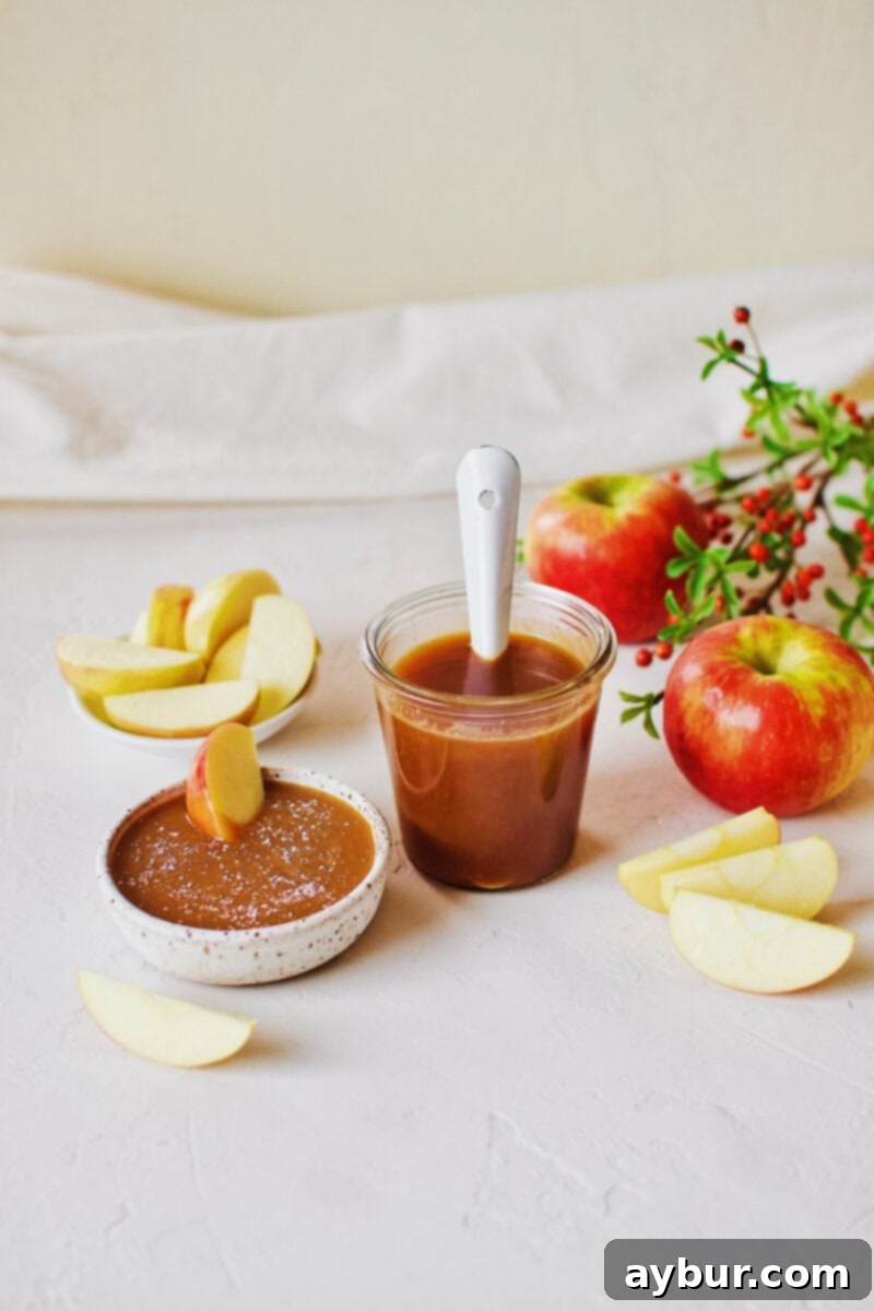 Velvety Homemade Caramel Sauce 8 A jar of smooth, golden Homemade Caramel Sauce ready for use, perfect for any sweet treat.