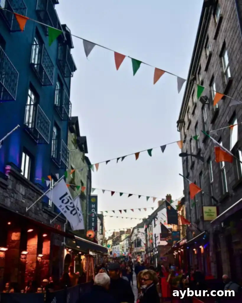 Green Festivities 6 Galway, Ireland city street lined with Pubs
Photo by KendellKreations