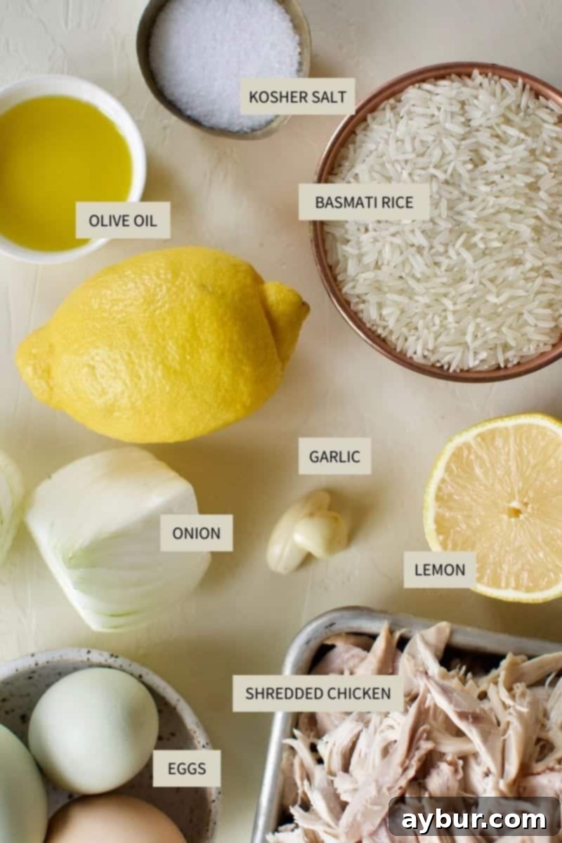 Zesty Greek Avgolemono Chicken Rice Soup 3 A curated selection of fresh ingredients including lemons, eggs, chicken, and rice, laid out on a kitchen counter, ready for making Greek Lemon Rice Soup.