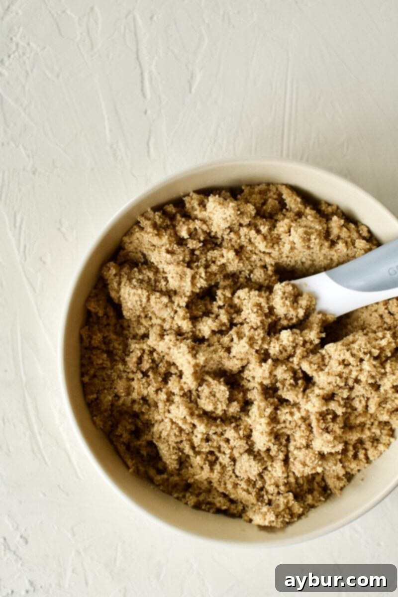 Graham Cracker Crust mixture in a mixing bowl before pressing into the pan.