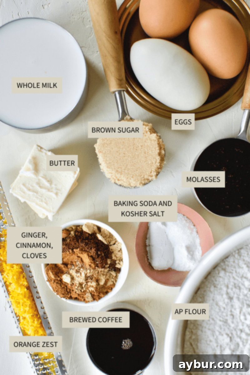 All the essential ingredients for making Gingerbread Pancakes are neatly laid out on a rustic wooden table, including flour, eggs, molasses, spices, and an orange for zest.