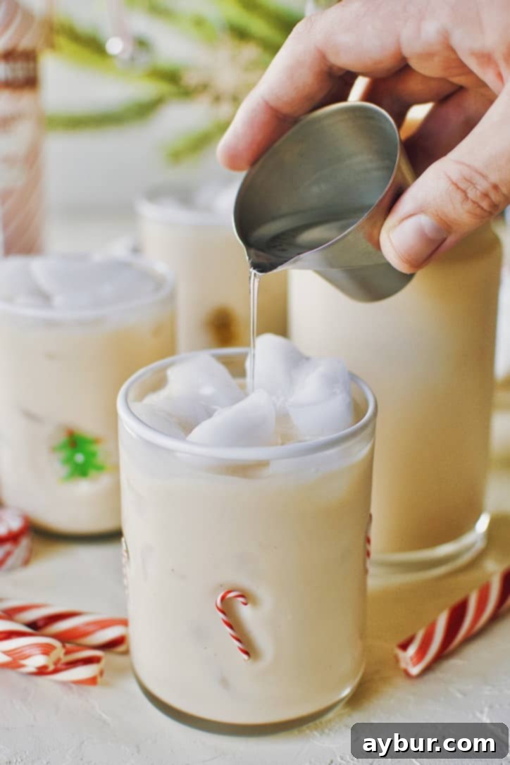 A pitcher of Peppermint Chai Eggnog Cocktail mix ready for serving, showcasing its rich, creamy texture.