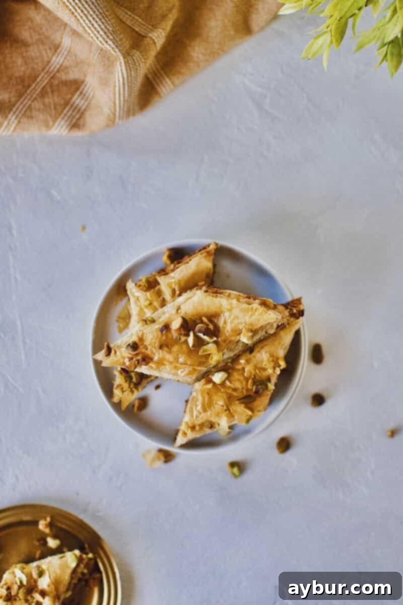 Joanna Gaines recipe for Baklava stacked on a white plate.