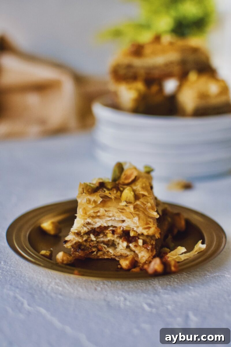 Joanna Gaines recipe for Baklava served right out of the baking dish on a gold plate.