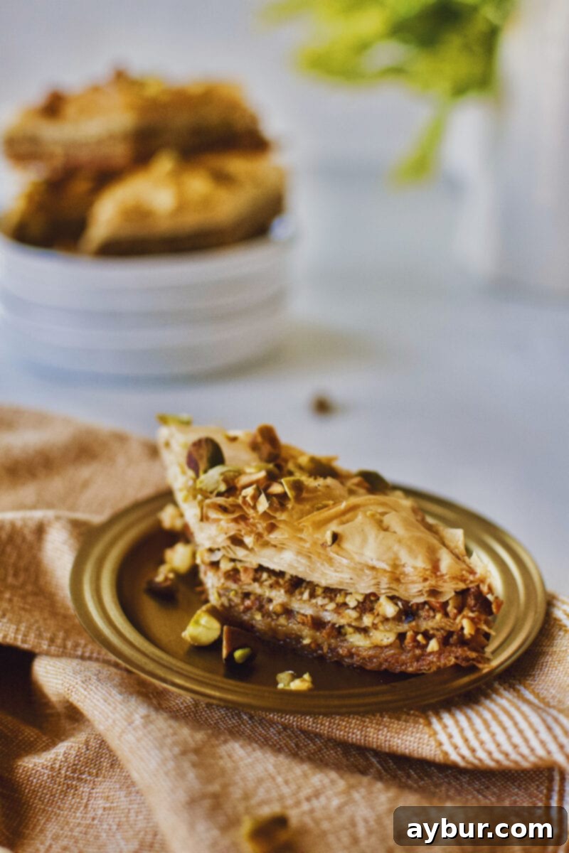 Joanna Gaines recipe for Baklava served right out of the baking dish on a gold plate.