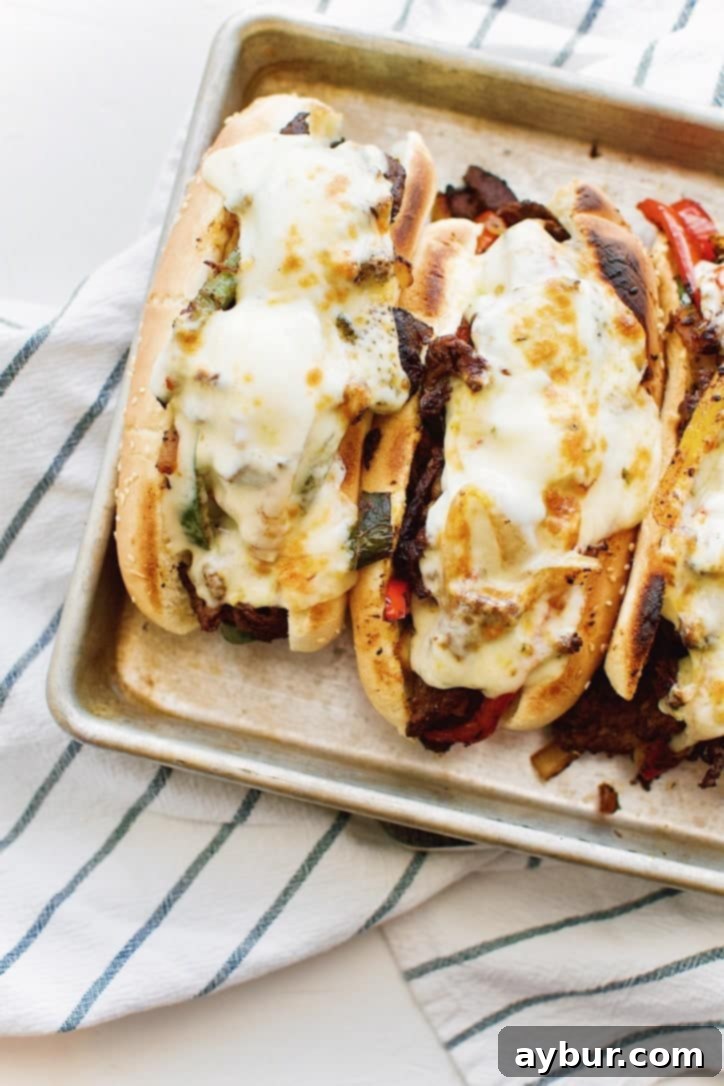 Joanna Gaines's delightful recipe for Philly Cheesesteaks, straight from the Magnolia Table Cookbook Vol. 2, showcasing the rustic appeal of her home-style cooking.