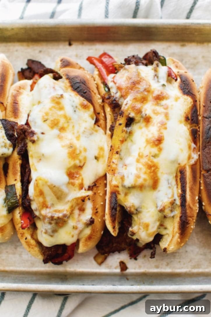 An appetizing overhead shot of Joanna Gaines's Philly Cheesesteaks ready to be served, a testament to the simplicity and deliciousness of the Magnolia Table Cookbook Vol. 2 recipe.