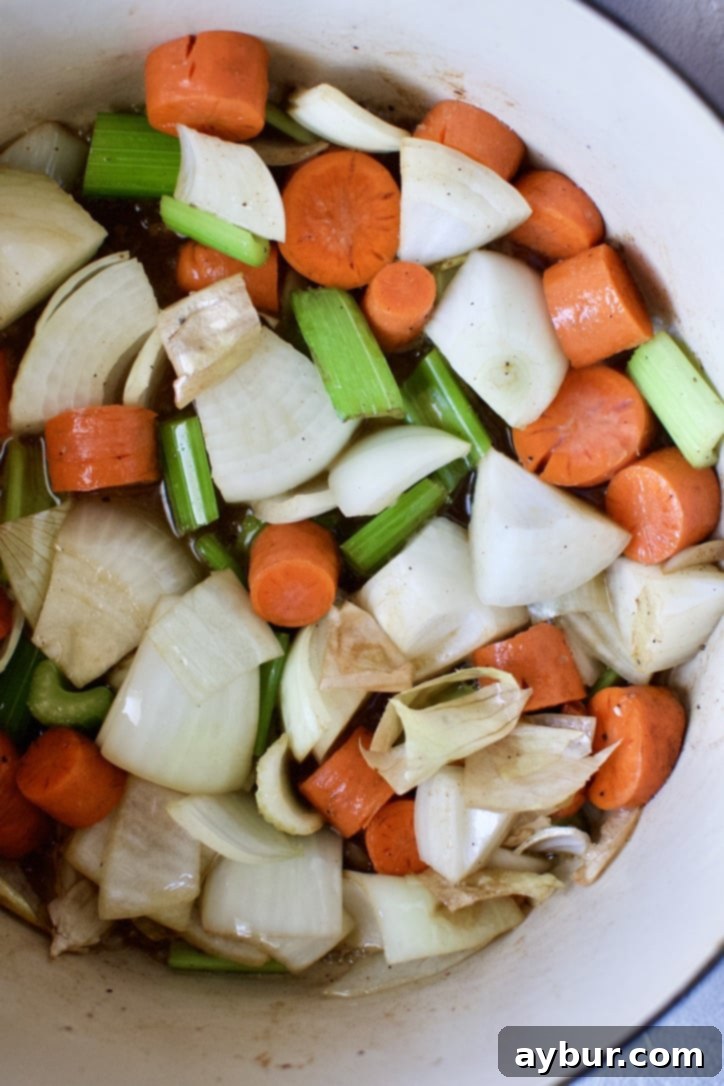 Burgundy-Braised Beef Short Ribs 6 Diced carrots, onions, and celery sautéing in the rendered beef fat at the bottom of a large dutch oven, softening and releasing their aromas.