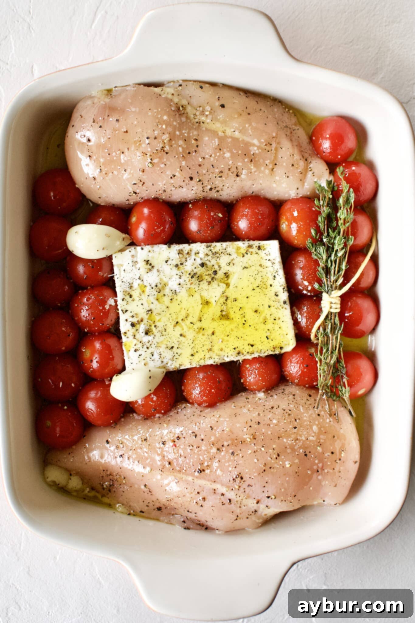 Easy Baked Feta Pasta with Chicken 4 Baked Feta Pasta with Chicken nestled into a baking dish.