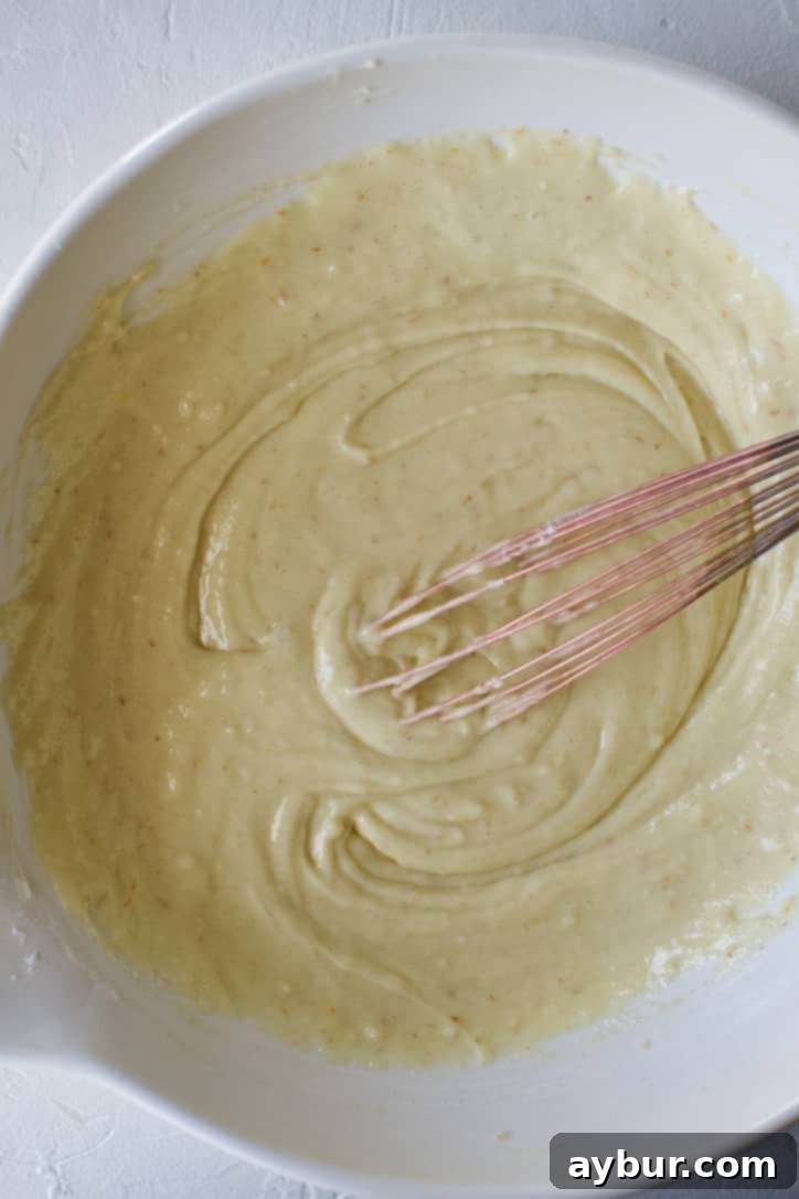 The flour blended with the wet ingredients in a bowl.