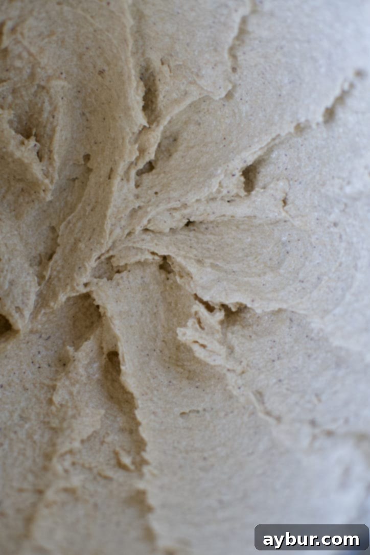 Perfectly creamed brown butter and light brown sugar, exhibiting a pale and fluffy texture, indicating proper aeration.