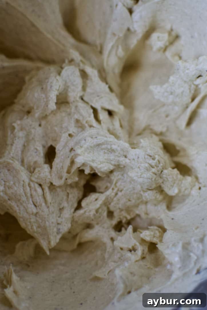 Eggs whipped thoroughly into the cake batter, creating a light and airy consistency.