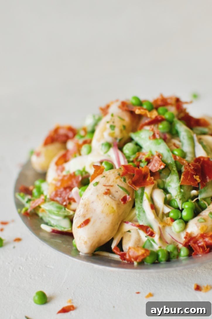 Finished Spring Potato Salad with Peas and Prosciutto, ready to serve.