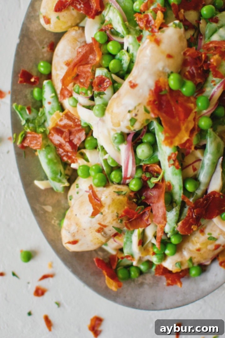 Platter of Spring Potato Salad with Peas and Prosciutto ready to serve.