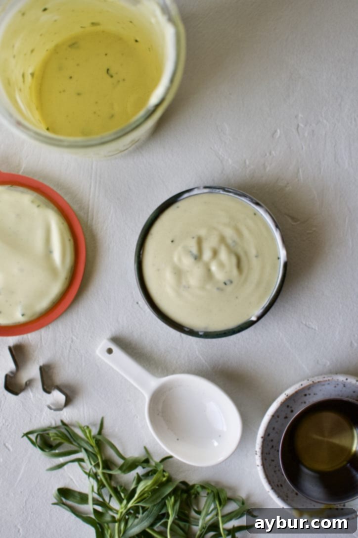 Tarragon Vinaigrette in a jar with some poured into a small bowl.