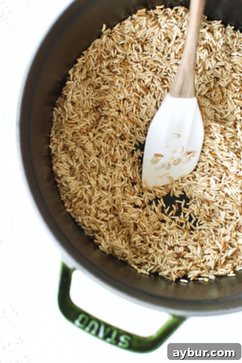 Toasting the rice in the bottom of a heavy pot.