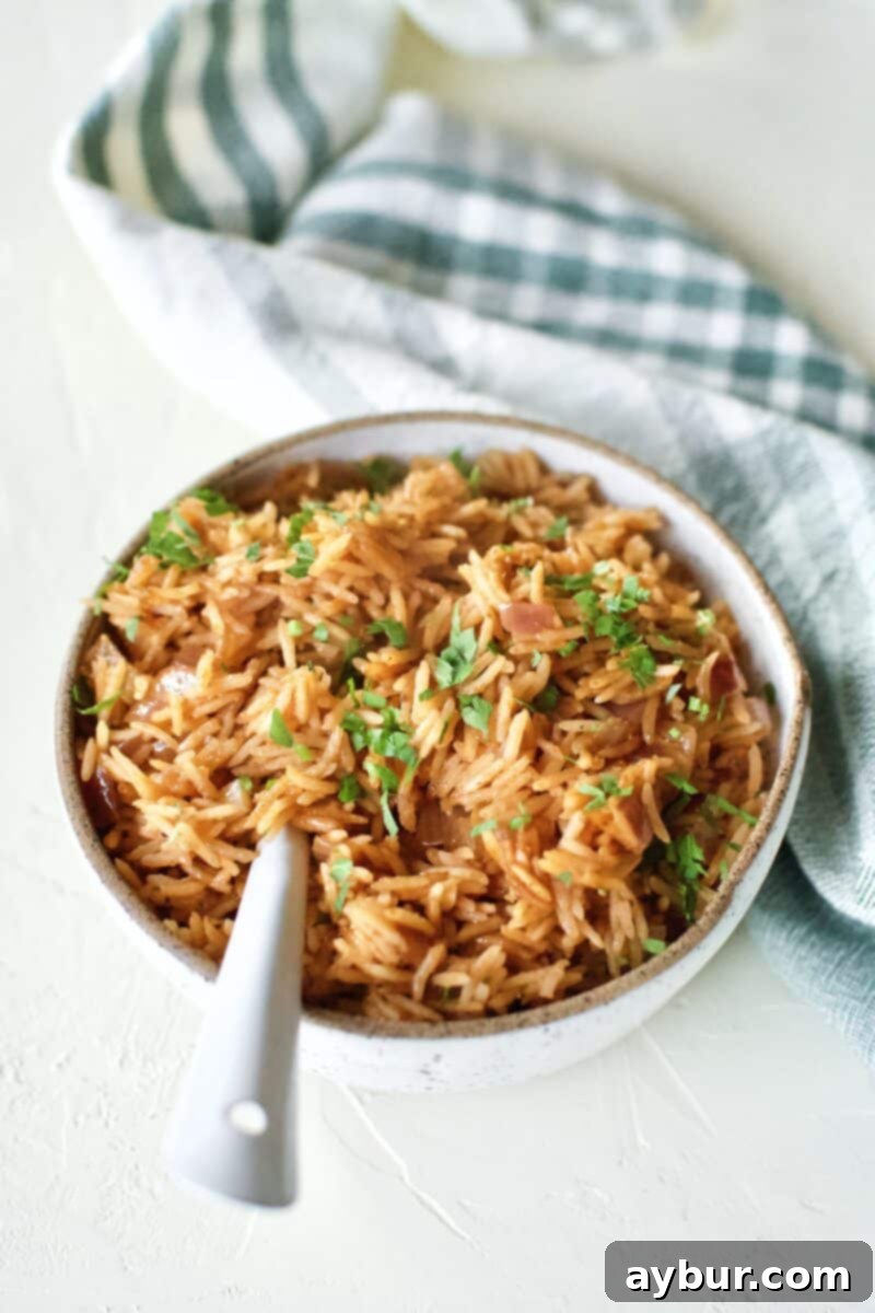 Weta Rice in a serving bowl, topped with Cilantro, and and spoon in the bowl.