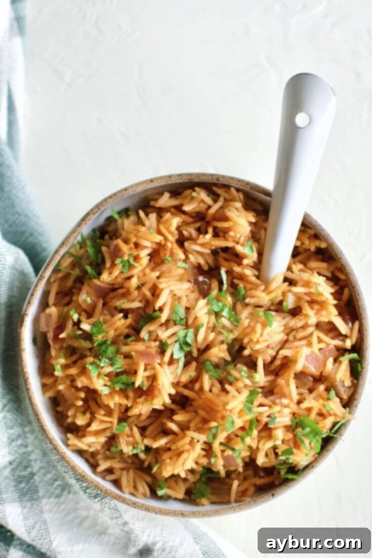 Weta Rice in a serving bowl, topped with Cilantro, and and spoon in the bowl.