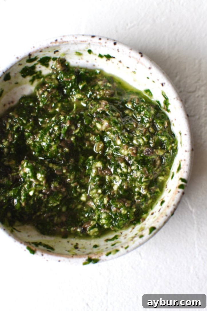 Truffle Fries 6 Truffle, garlic, parsley, and white truffle oil mixed together in a bowl.
