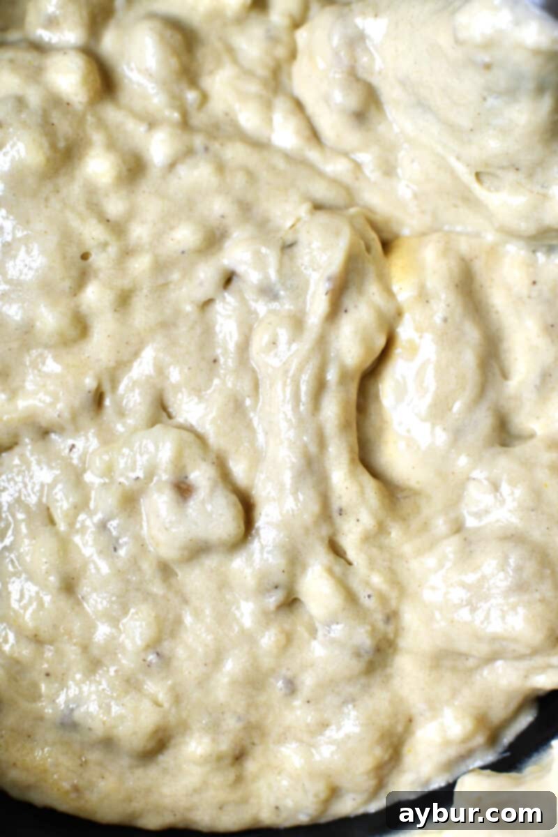 Nutty Brown Butter Banana Loaf 6 Smooth, cohesive banana bread batter after all dry ingredients and walnuts have been mixed in, ready for chocolate chips.