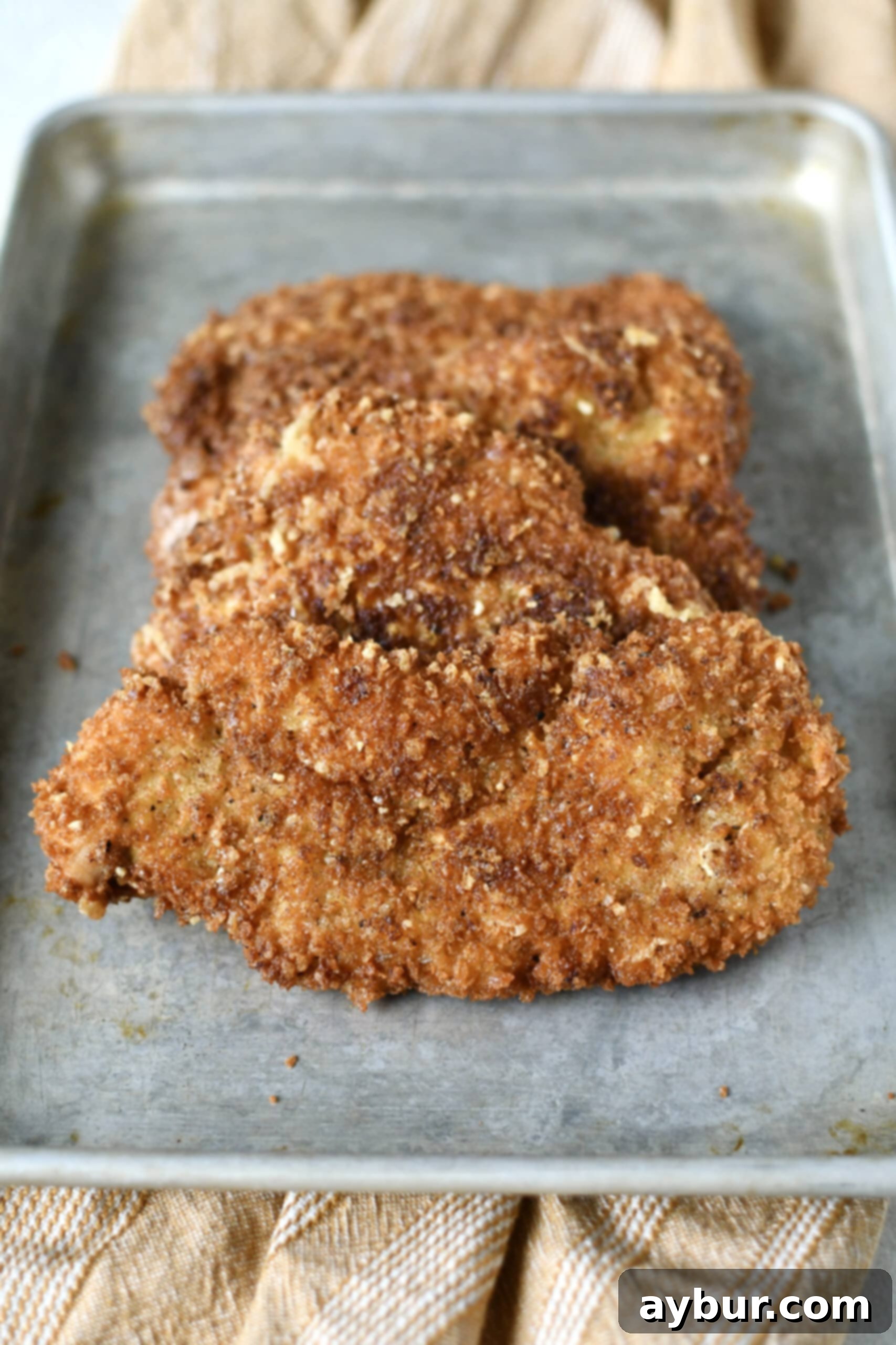 Crispy Parmesan Chicken, hot out of the pan and ready to be served.