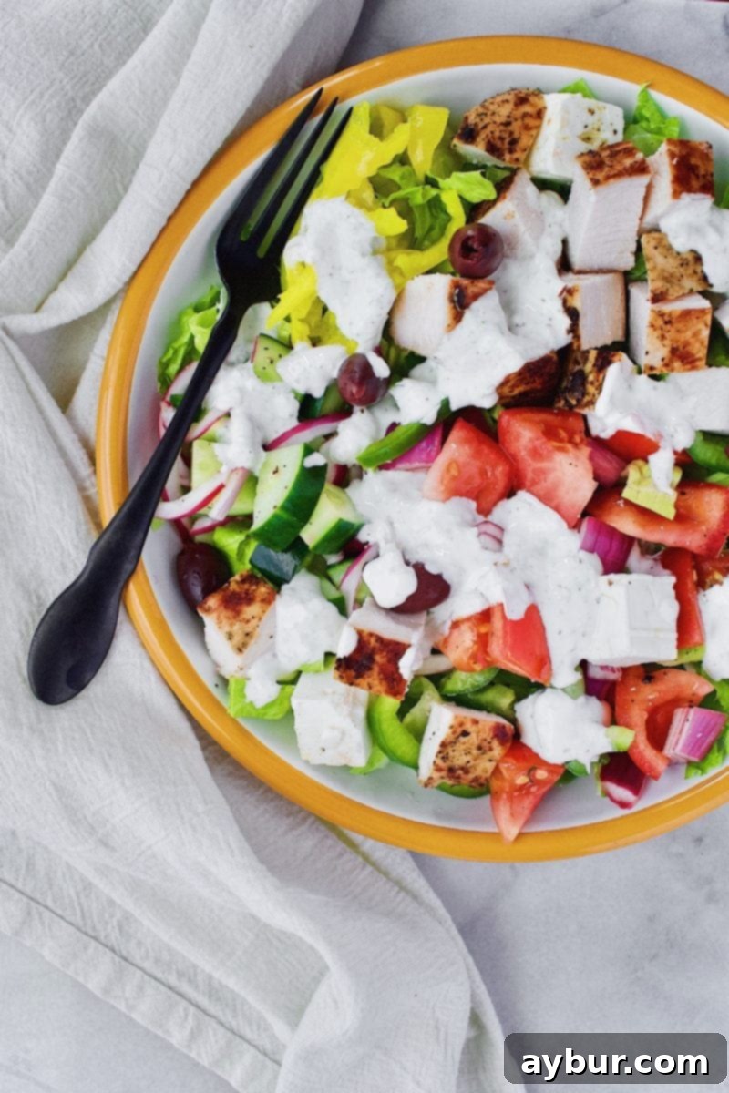 Zesty Greek Chicken Salad 2 Vibrant Greek Chicken Salad with grilled chicken, feta, olives, and fresh vegetables