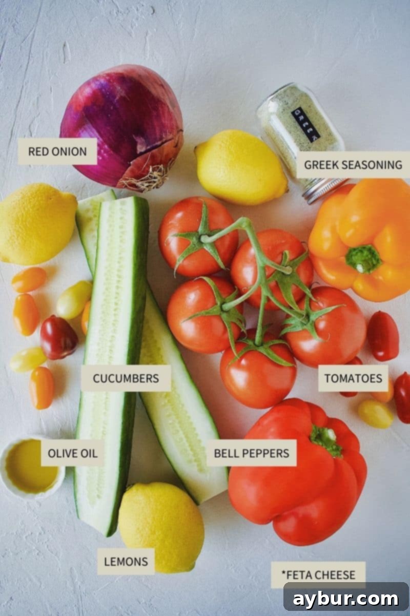A collection of fresh, vibrant ingredients laid out, including tomatoes, cucumbers, red onion, bell peppers, lemon, and a block of feta cheese, ready to make Traditional Greek Salad.