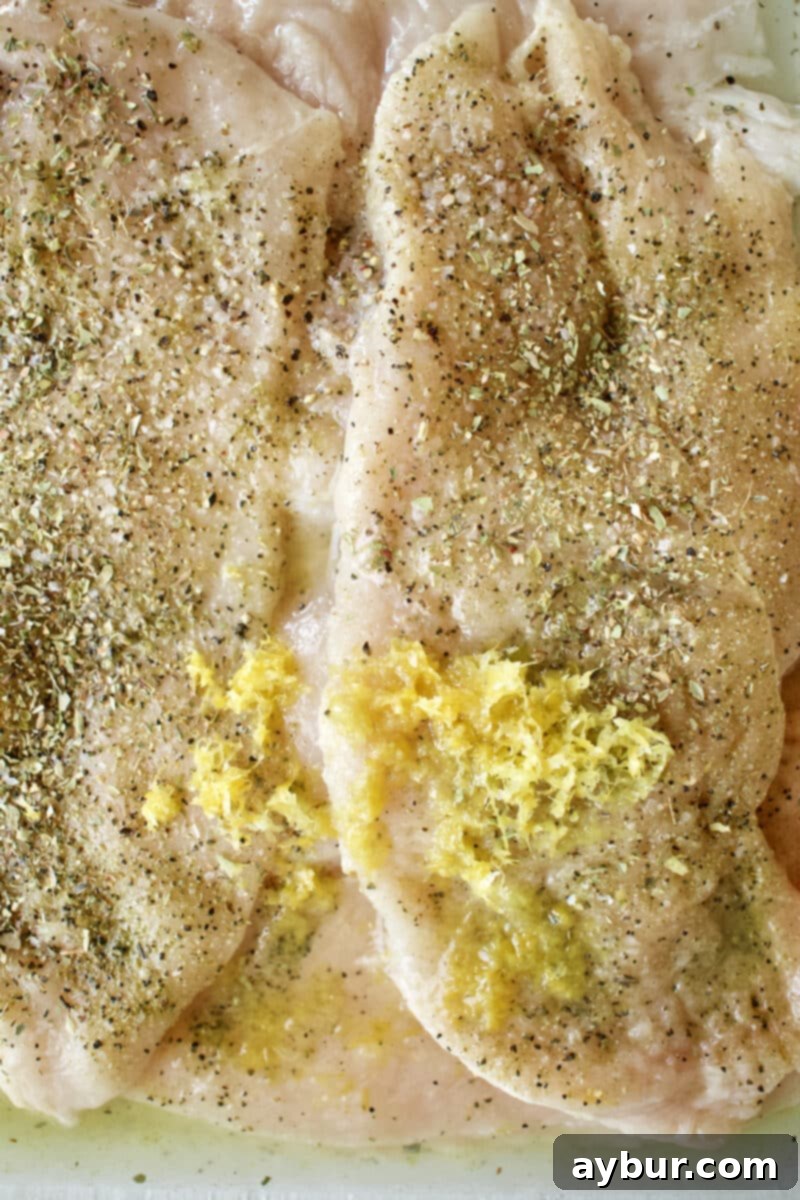 Quick & Easy Greek Chicken with all ingredients added to a container to marinate.