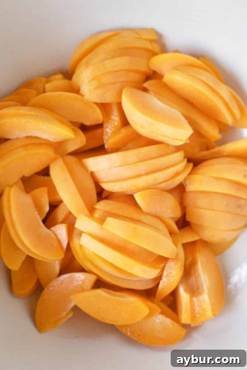 Apricot Tart 4 Fresh apricots sliced and placed in a large bowl.