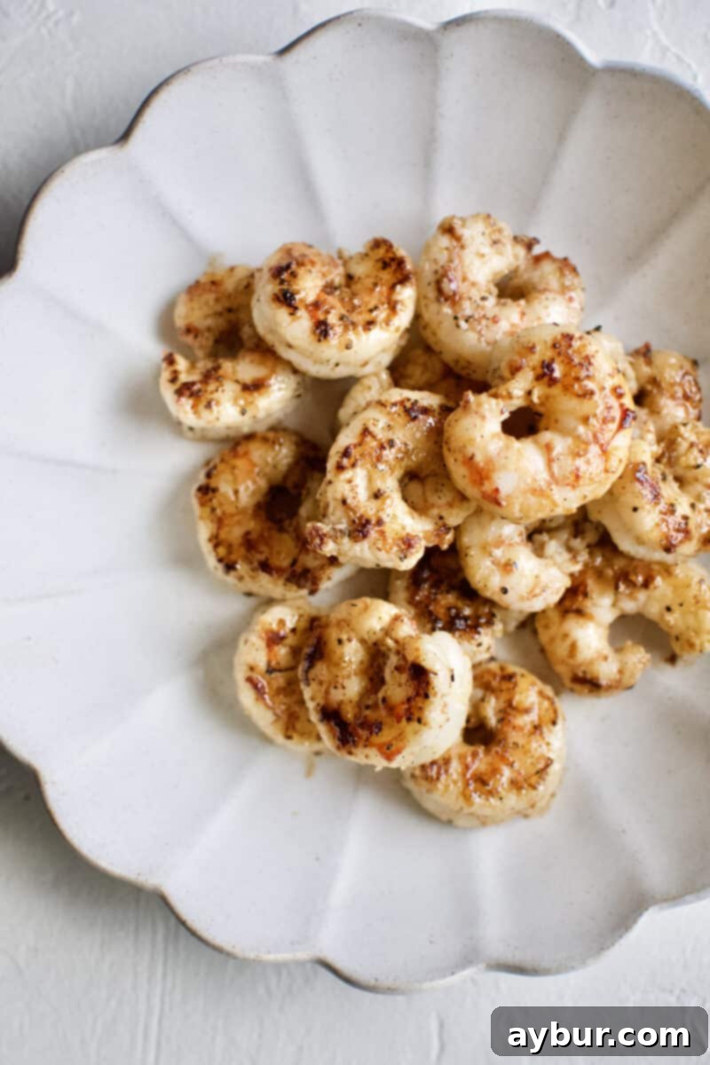 Perfectly cooked Argentinian Red Shrimp, seared to a beautiful golden-red color, ready to be added to tacos.