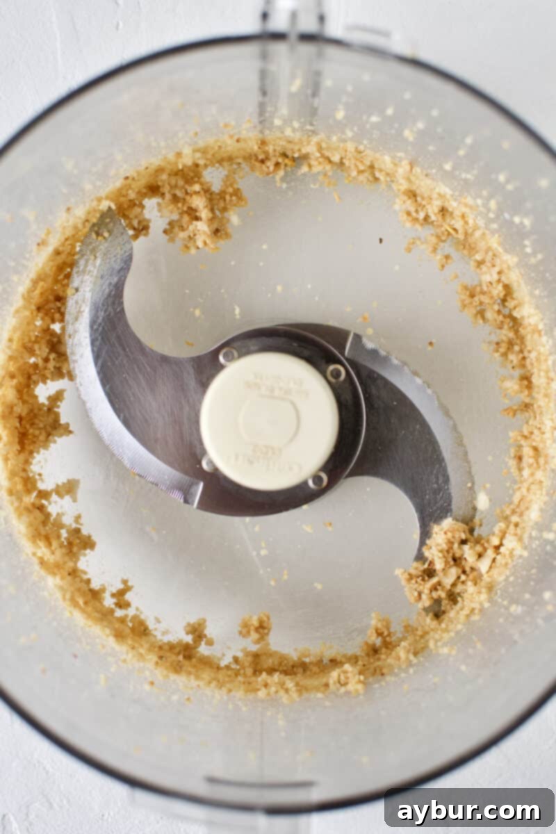 Pine nuts and garlic ground to a coarse paste in a food processor.