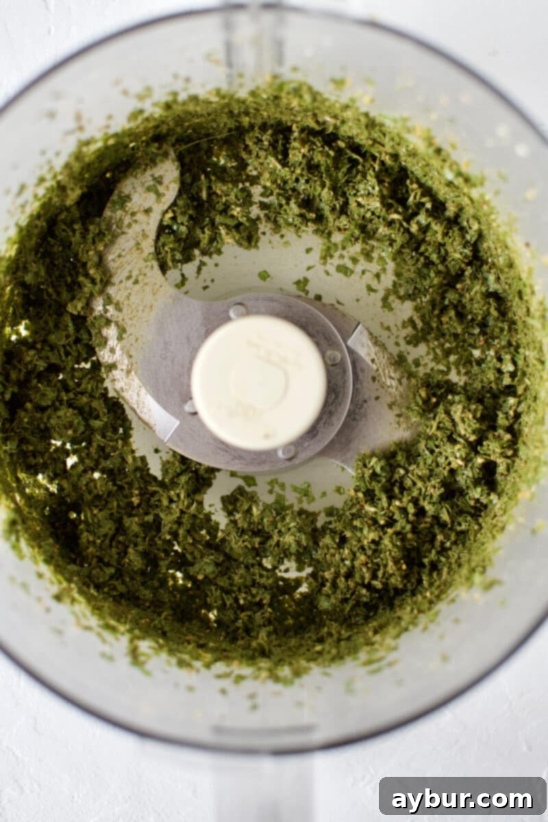 Pine nuts and garlic paste with basil added and chopped in a food processor.