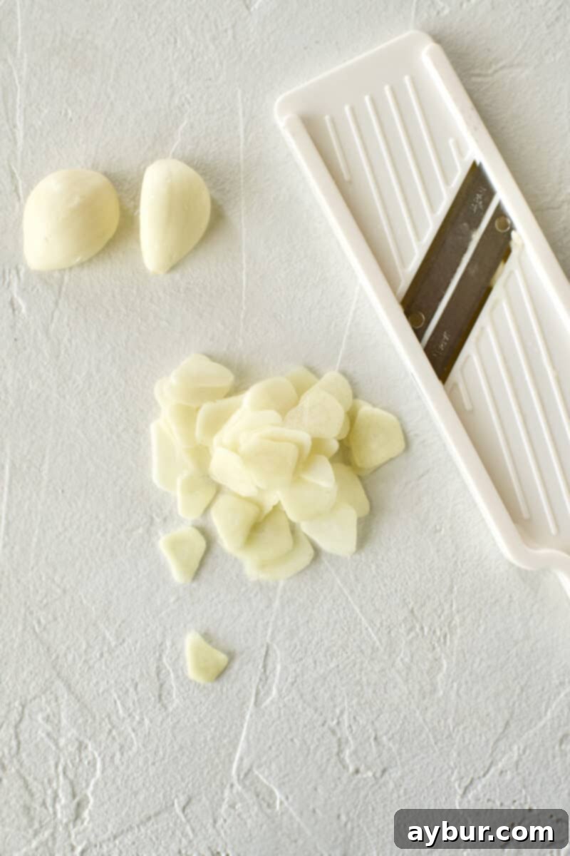 Smoky Baba Ghanoush with Golden Garlic 4 Garlic precisely sliced using a mini mandoline.