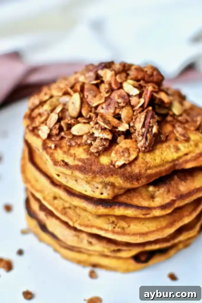 Fluffy Pumpkin Spice Pancakes 3 Pumpkin Crunch Pancakes close up with maple syrup