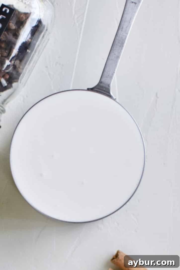 High-quality heavy cream, an essential ingredient for a rich and creamy sugar-free pumpkin spice syrup.