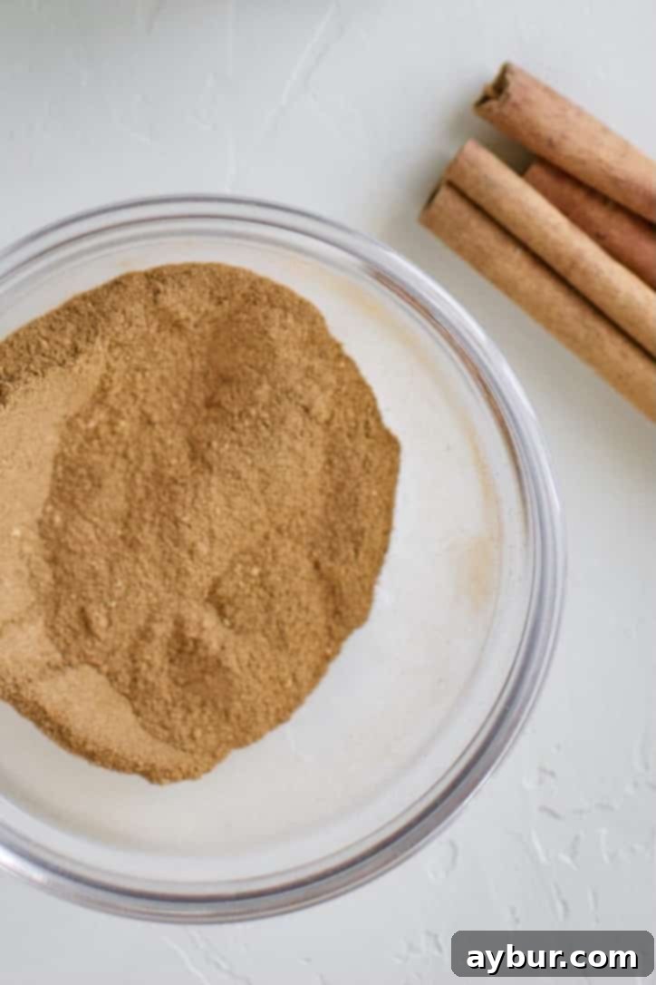 A selection of aromatic pumpkin pie spices, crucial for the signature fall flavor of the syrup.