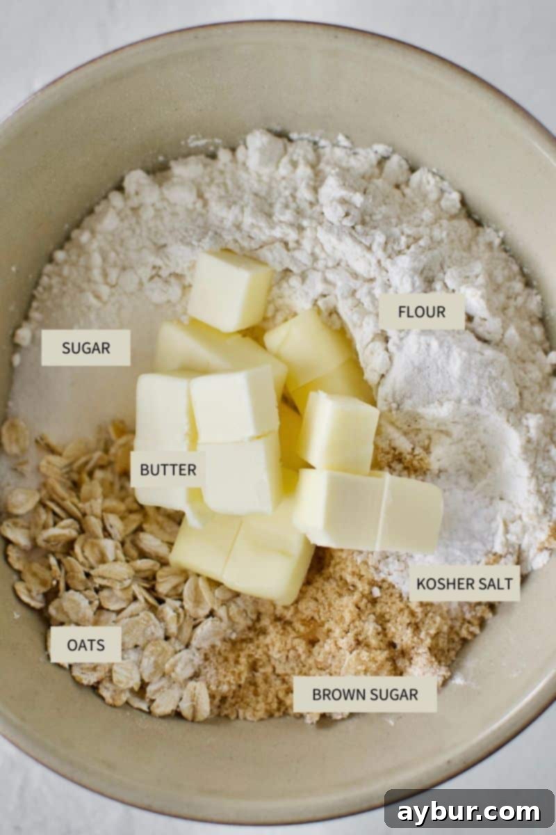 Ingredients specifically for the crumble topping, including quick oats, all-purpose flour, both granulated and brown sugar, and diced cold butter, ready to be combined.