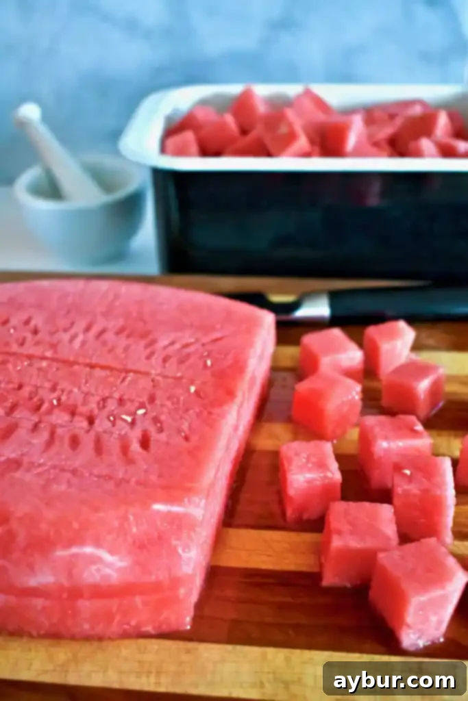 Unlock the Art of Watermelon Slicing 2 Freshly cut watermelon cubes ready for serving.