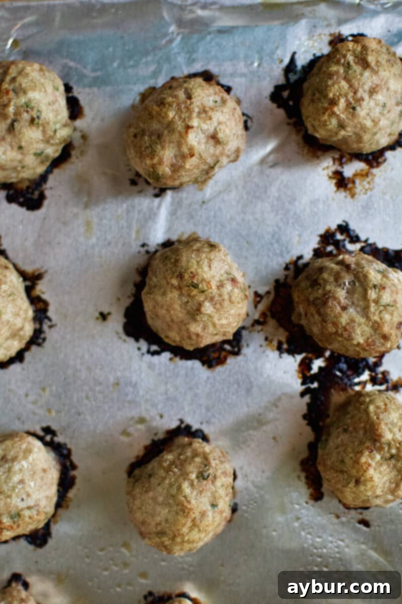 Cooked Swedish meatballs, lightly browned and set after baking in the oven, ready for the sauce.