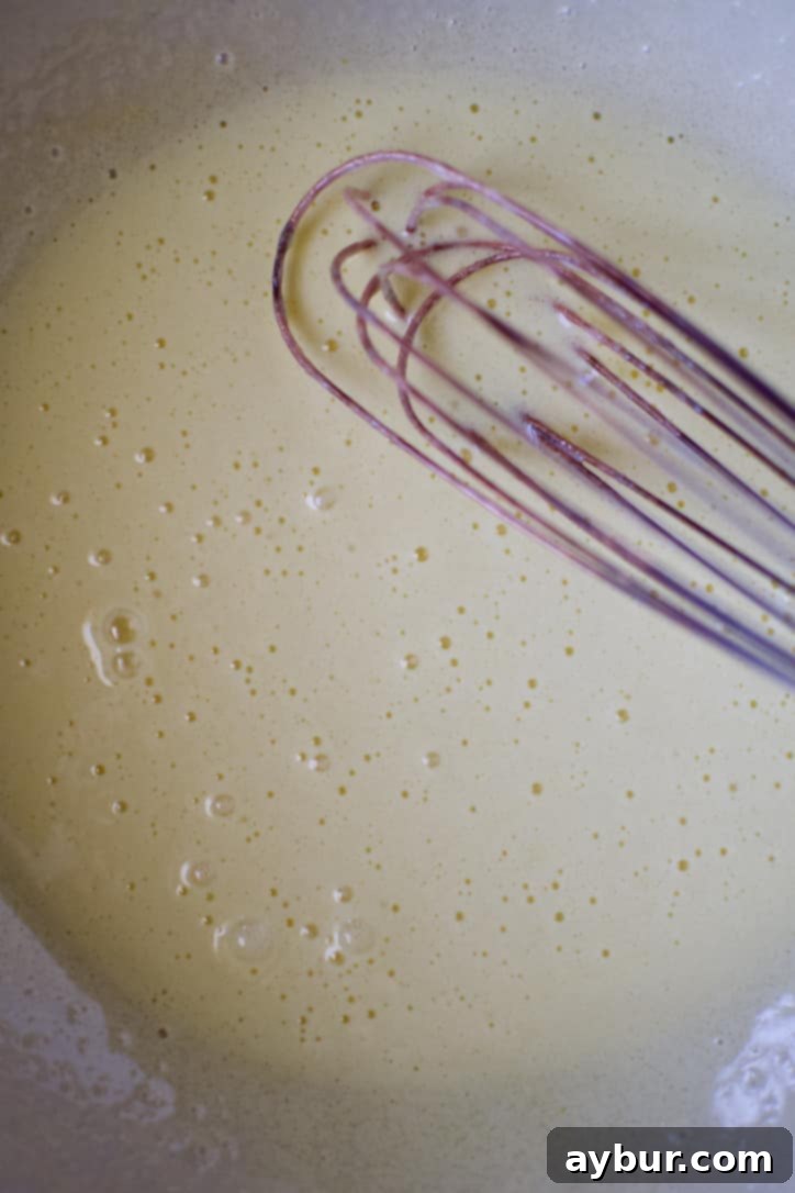 Harvest Apple Cider Donut Cake 5 The egg and sugar mixture after being thoroughly whisked, now light, airy, and pale in color, ready for the next step.