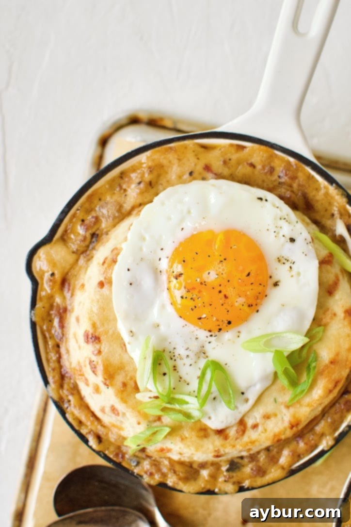 Sunrise Pie 16 Breakfast Pie ready to eat. Topped with a fried egg and green onions.