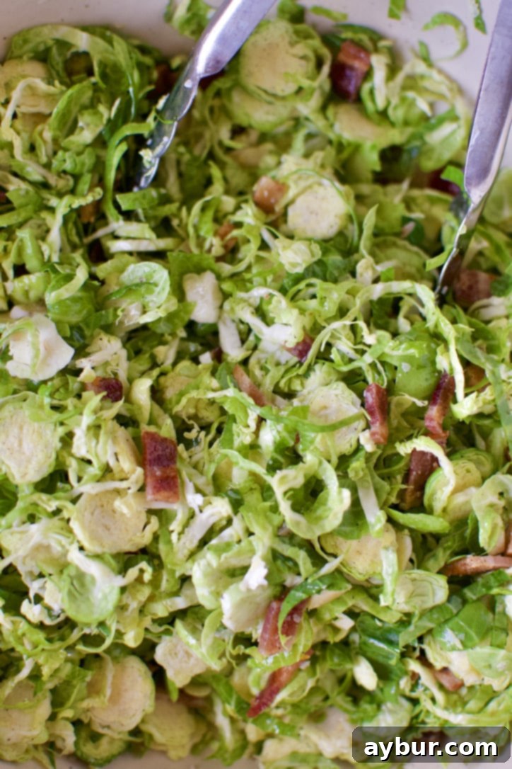 Brussels sprouts mixture spread on a baking sheet.