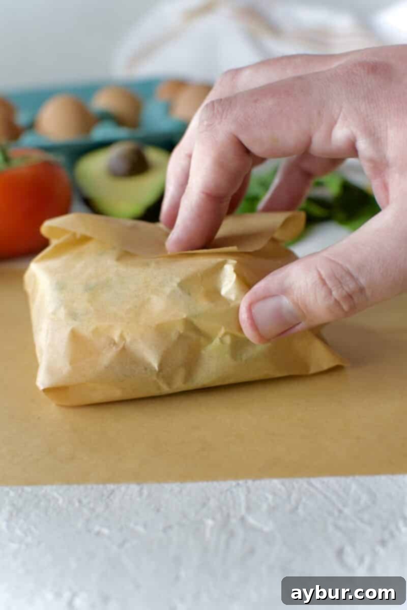 Wholesome Breakfast Sandwich 21 Storing multiple wrapped eggwiches in a container.